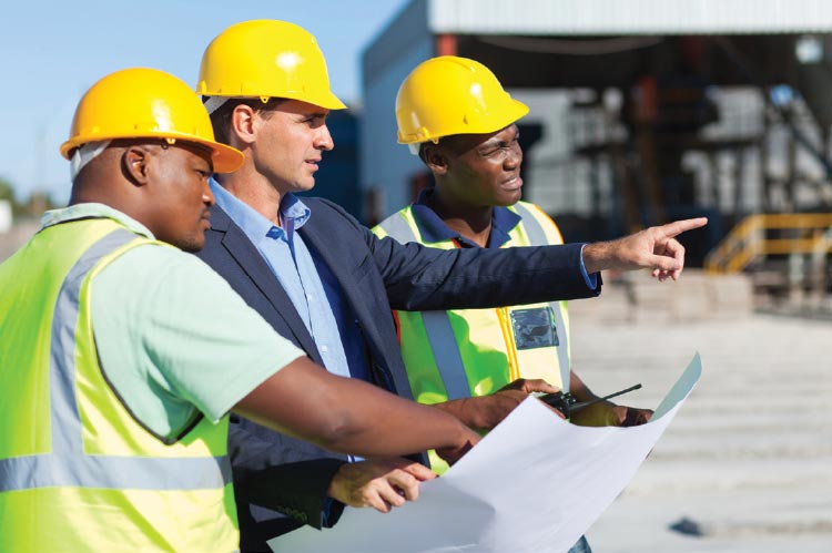 Construction workers discussing their project